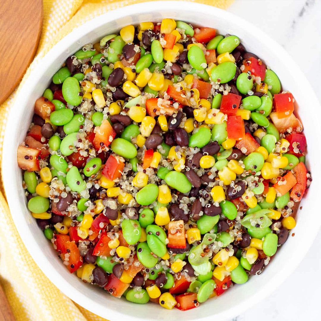 Quinoa Salad with Edamame Beans, Red and Orange Peppers, Corn, Craisins