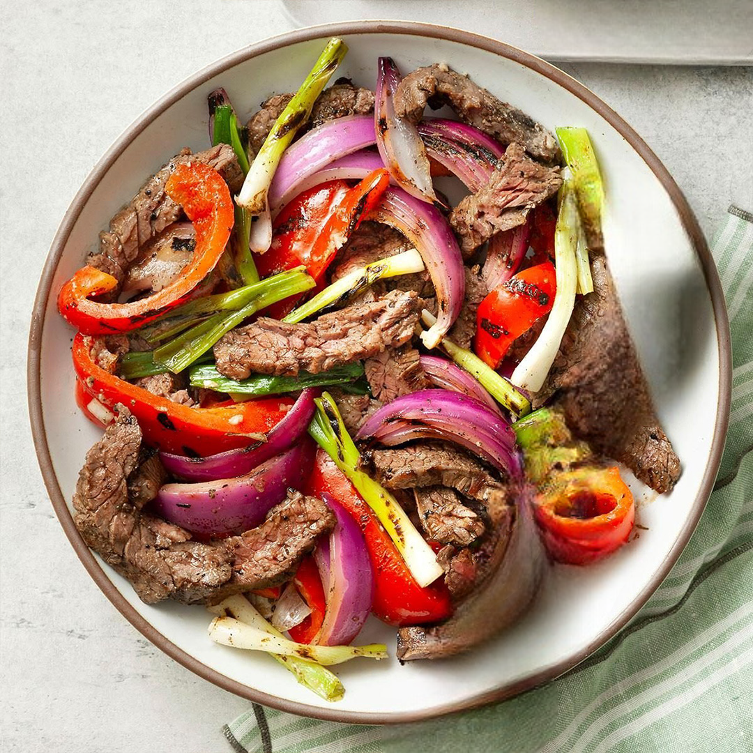 Grilled Sliced Skirt Steak with Tri-Colored Peppers